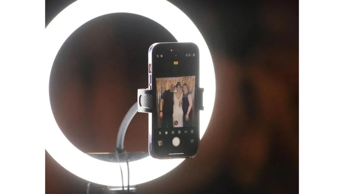 DIY photo booth station with phone and ring light for budget-friendly wedding photography