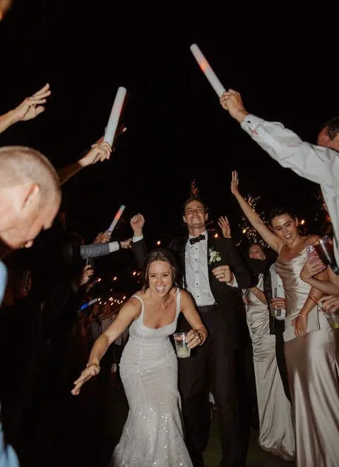 Bride and groom celebrating on the live wedding slideshow