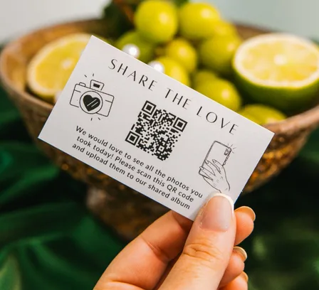 Share the Love wedding QR card at a reception