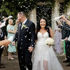 Guests celebrating the bride and groom with confetti