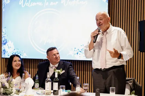Father of the bride giving a toast during the reception