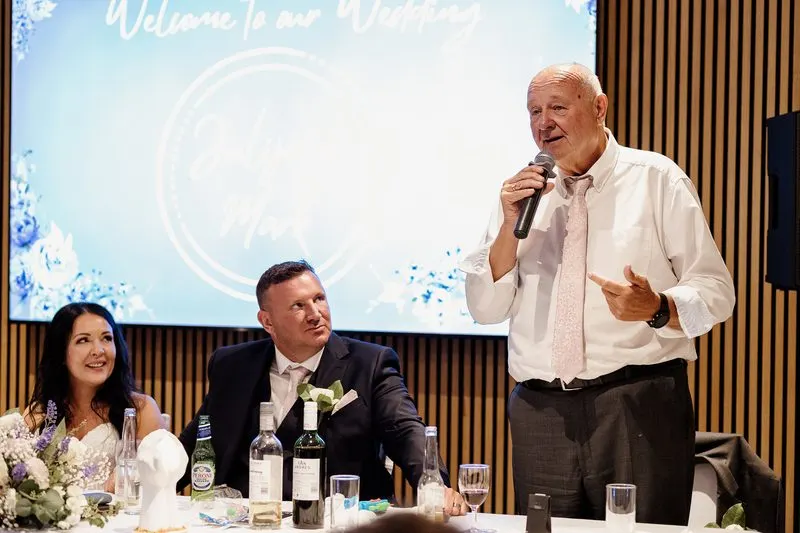 Father of the bride giving a toast during the reception
