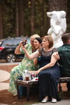 Guests laughing while taking a photo together